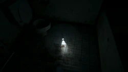 The flashlight in P.T. as it appears when found on the bathroom floor.