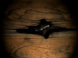 The motorcycle key under the floorboards.