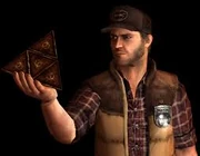 Travis sosteniendo el Flauros.