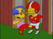 Milhouse kicking Bart in the crotch