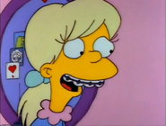 Becky's braces shown at Lisa's slumber party.