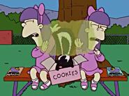 Sherri and Terri get sprayed by a skunk in the cookie box via a prank from Bart