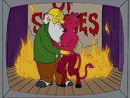 An actor portraying the Devil, making out with Charles Darwin