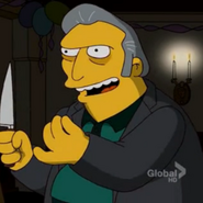 Fit-Fat Tony holding a knife