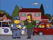 Wiggum takes notes on Ned's sobriety test while Maude, Rod and Todd watch