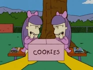 Nelson gives a box of cookies to Sherri and Terri.