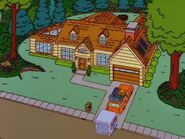 The Simpsons moving into the house.