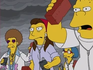 Disco Stu part of an angry mob throwing bricks at the Simpsons' house during "Podcast News"; behind Ruth Powers, Luann Van Houten, and Kearney
