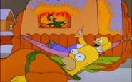 Homer imagines Ned being trapped in his burning house and Homer is laughing at his misery.