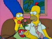 Marge calls Rubber Baby Buggy Bumpers Babysitting Service to find a babysitter but hears Moe cursing instead.