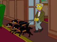 Waylon Smithers with the hounds on leashes.