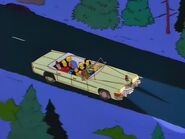 John driving the family home after Homer's near-death reindeer experience.