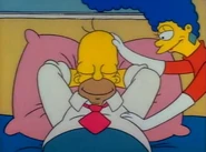 Homer sleeping in bed.