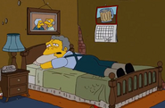 A picture of Moe's parents, above his bed ("Father Knows Worst").