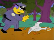 Wiggum trying to get his badge back from a duck