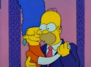 Homer and Marge continuing their dancing.