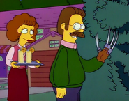 Ned Flanders with a Freddy Krueger glove.