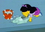 Jessica limpando a calçada