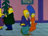 Homer and Marge dancing, another pair of dancers watch them...