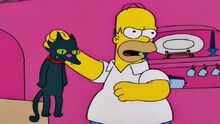 Homer socando o gato Bola de Neve