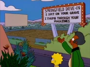 Apu and Lisa viewing the drive-in from the roof of the Kwik-E-Mart