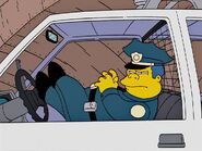 Wiggum in his police car