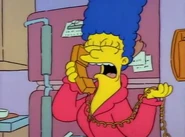 Marge cries over the phone.