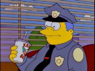 Wiggum eating at Krusty Burger