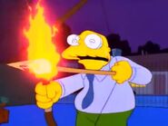 Moleman holding a bow with a flaming arrow.