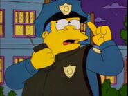 Wiggum in a police vest