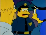 Chief Wiggum with black hair.