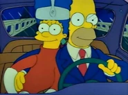 Marge and Homer driving to the hotel.
