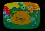 Bubbles jumps into a honey jar.