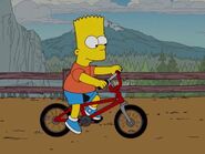 Барт едет на своём велосипеде.
