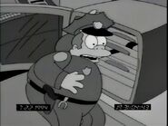 Wiggum's tie gets stuck and he is most likely too stupid to think about taking his tie off