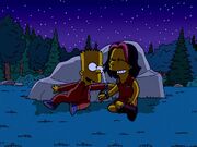 Bart and Gina playfully pinch each other.