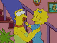 Maggie giving Marge her pacifier