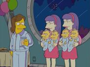 Sherri and Terri holding their Nelson-lookalike quadruplets