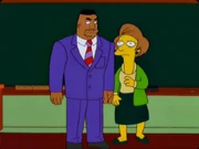 Edna with a dark green skirt