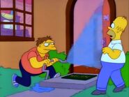 Barney spraying water at Homer