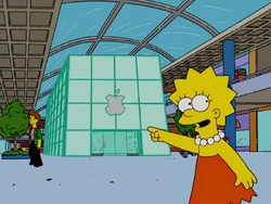Lisa pointing at a Mapple Store.