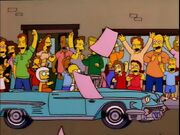 A black man with a yellow arm