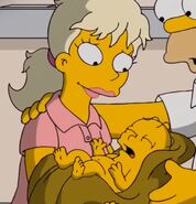 Holding Homer Jr. seconds after he was born.