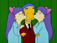 Milhouse getting kissed by Sherri and Terri