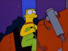 Marge riding on a bulldozer.