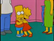 Lisa hugging her brother.