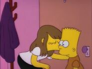 Laura giving Bart a kiss.