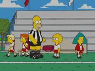 Sophie in her soccer uniform