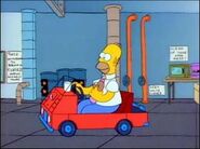 Homer is driving a small car at work