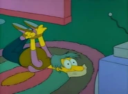 Lucille is tied up watching "The Happy Little Elves"...